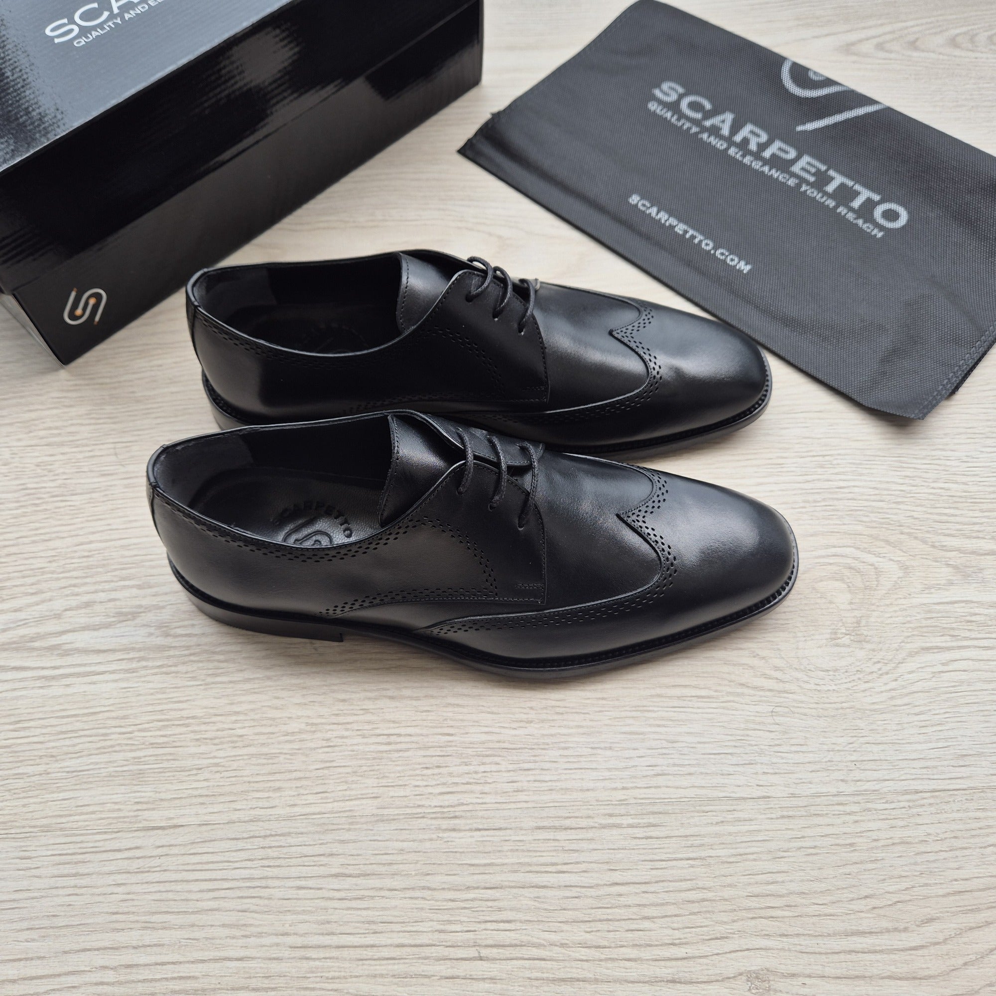 Rinaldo Jet Black Wingtip Brogue Derby — three-quarter view | Scarpetto