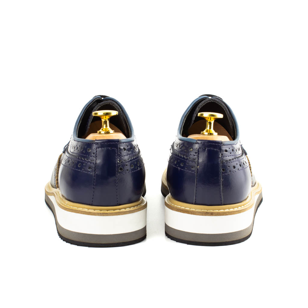 Vestito Navy Wingtip Leather Derby for Men — three-quarter view | Scarpetto