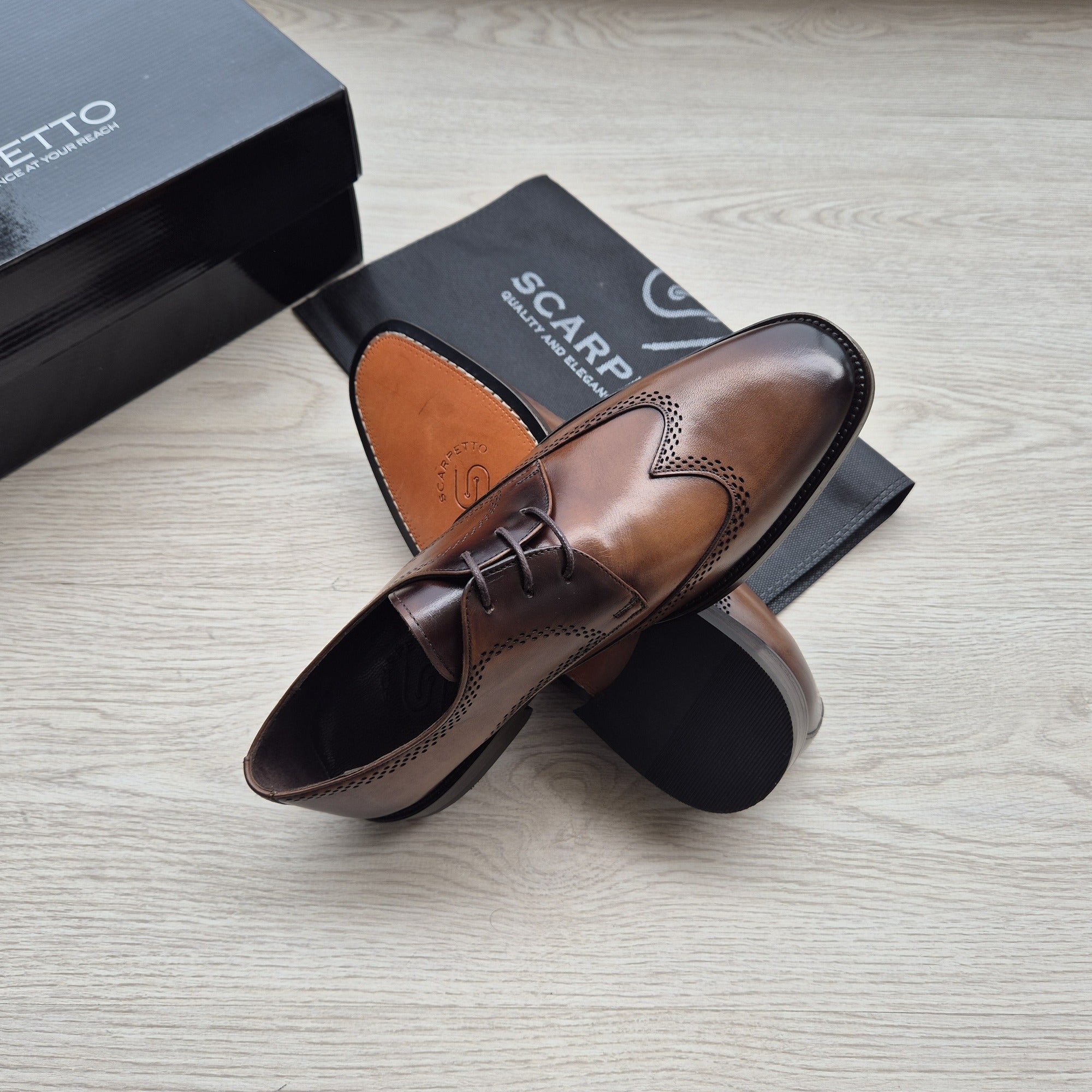Rinaldo Whiskey Brown Wingtip Brogue Derby — three-quarter view | Scarpetto